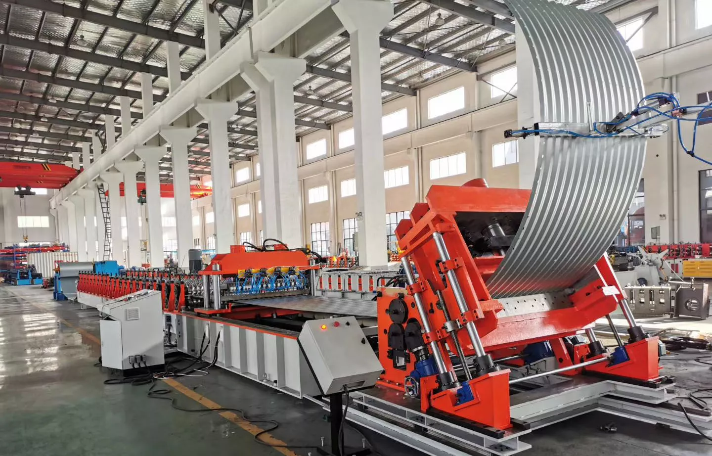 Steel plate bin forming machine.